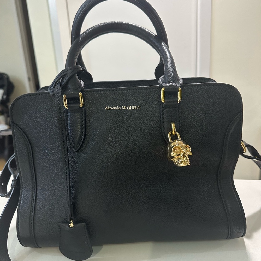 12” across, 8.5” tall, 7” deep 
Long strap
Pebbled leather